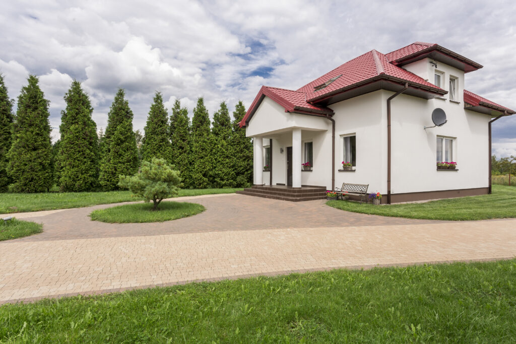 Big white house with patio and big garden